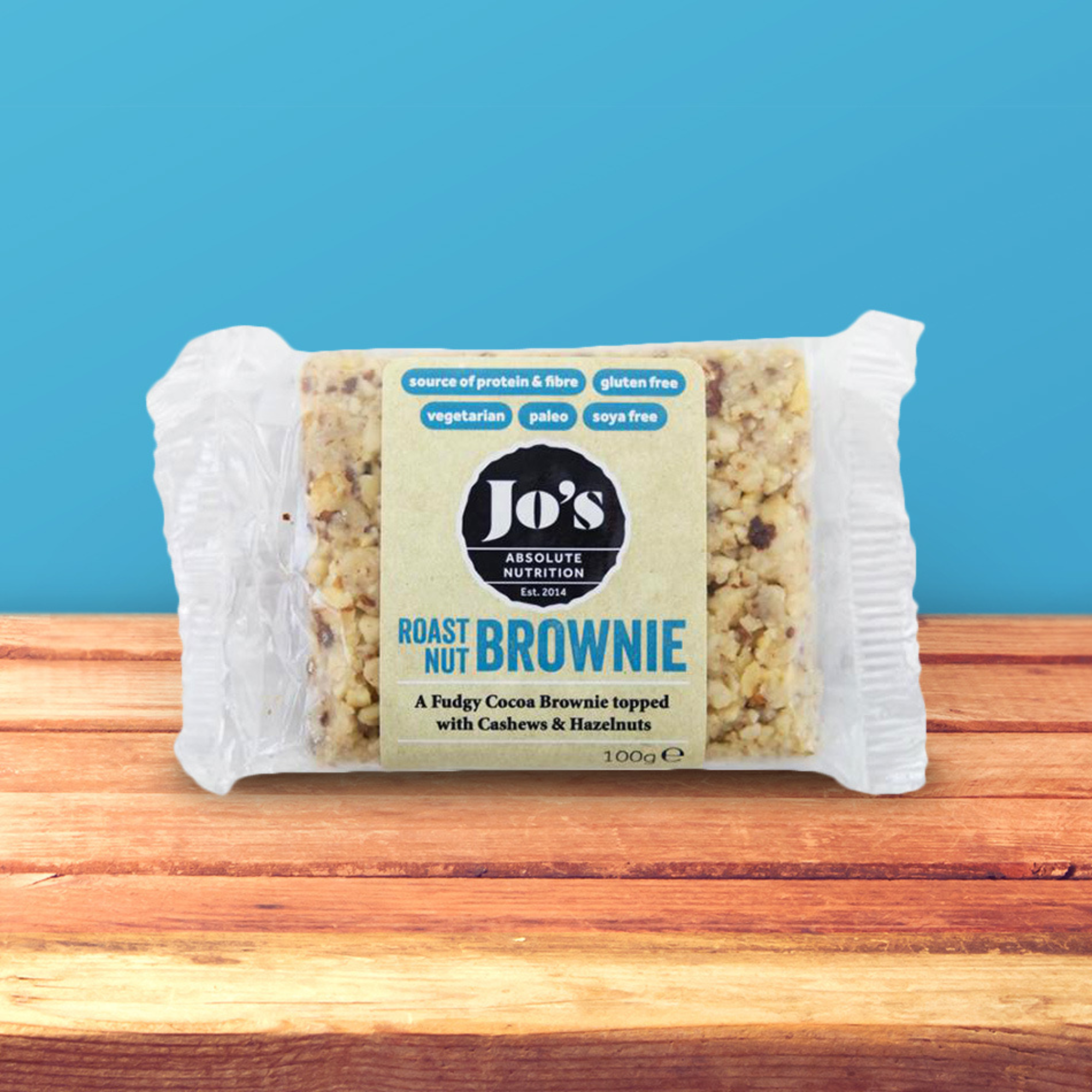 Healthy and Nutritious Jo's Absolute Nutrition Roast Nut Brownie placed on a wooden table